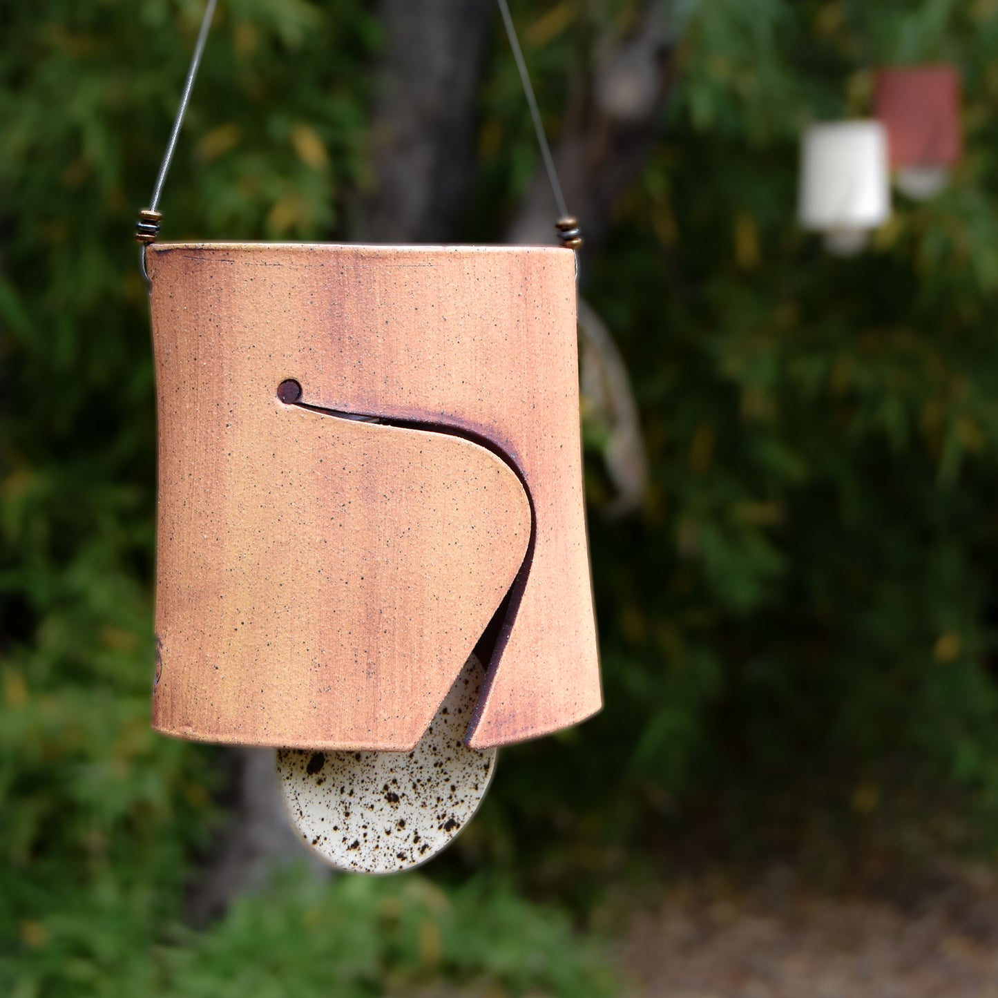 Modern Ceramic Wind Chime with Rustic Charm and Speckled Black and White Clapper